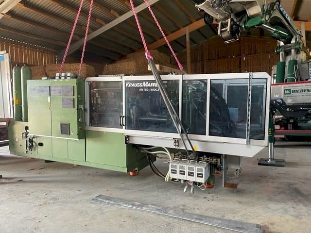 Front view of Krauss Maffei KW180 C3 hybrid machine